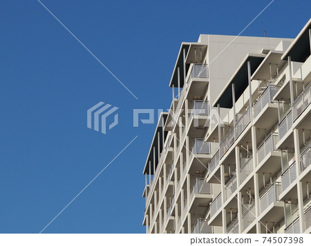 White mansion against the blue sky White mansion against the blue sky 74507398