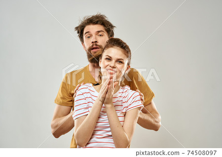 Young couple socializing romance lifestyle fashion fun light background 74508097