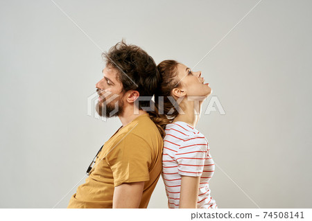 Young couple socializing romance lifestyle fashion fun light background 74508141
