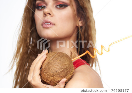 Beautiful woman with coconut cocktail in hands wavy hair cosmetics attractive look lifestyle leisure Beautiful woman with coconut cocktail in hands wavy hair cosmetics attractive look lifestyle leisure 74508177