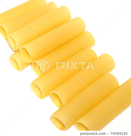 Yellow cannelloni pasta isolated on white background 74509295