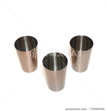 Stainless steel hiking shot glasses for liqueur isolated on white background Stainless steel hiking shot glasses for liqueur isolated on white background 74509440