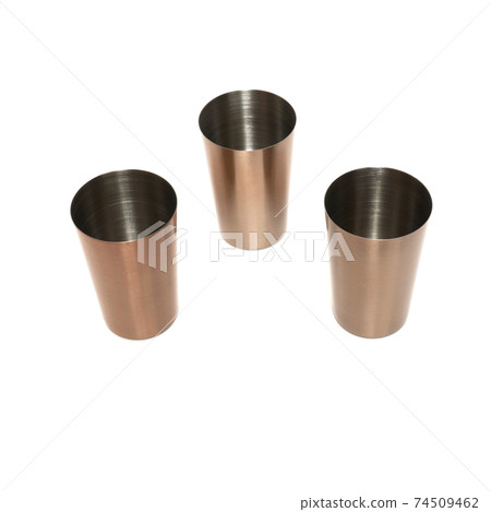 Stainless steel metal shot glasses for liqueur isolated on white background Stainless steel metal shot glasses for liqueur isolated on white background 74509462