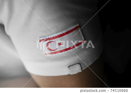 Patch of the national flag of the Northern Cyprus on a white t-shirt 74510988