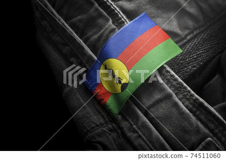 Tag on dark clothing in the form of the flag of the New Caledonia 74511060
