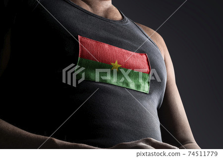 The national flag of Burkina Faso on the athlete's chest 74511779