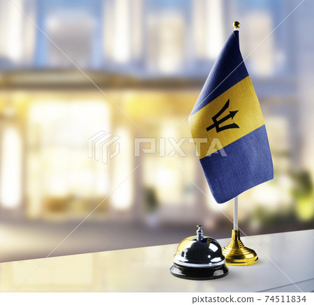 Barbados flag on the reception desk in the lobby of the hotel Barbados flag on the reception desk in the lobby of the hotel 74511834