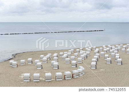 Beach landscape at Baltic Sea on Rugen Island. Beach chairs in Sassnitz Beach landscape at Baltic Sea on Rugen Island. Beach chairs in Sassnitz 74512055