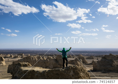 Successful  backpacker hiking on sand desert dunes 74514857