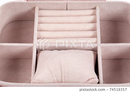 Close-up of an open red jewelry box. 74518357