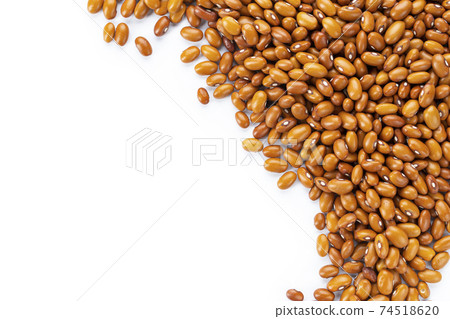 Dried orange beans on a white plate. Dried orange beans on a white plate. 74518620