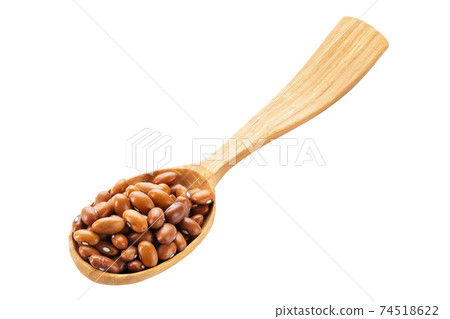 Dried orange beans in a wooden spoon isolated on a white background. Healthy food concept. Dried orange beans in a wooden spoon isolated on a white background. Healthy food concept. 74518622