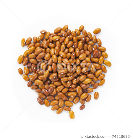 Dried orange beans on a white plate. Dried orange beans on a white plate. 74518623