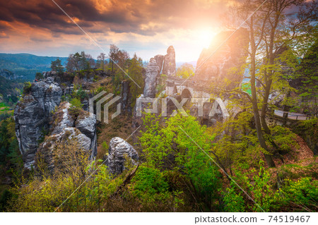 Famous pedestrian Bastei stone bridge at sunrise, Germany, Saxon Switzerland  74519467