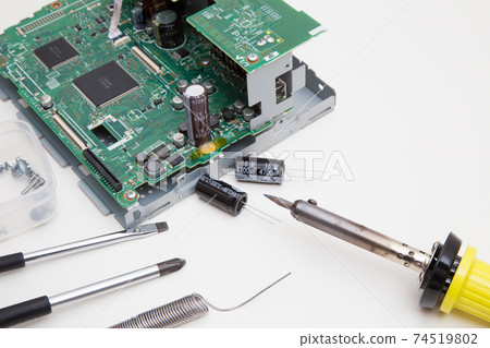 Soldering of electronic circuit parts using a soldering iron Printed circuit board repair Work of replacing electronic parts Soldering of electronic circuit parts using a soldering iron Printed circuit board repair Work of replacing electronic parts 74519802