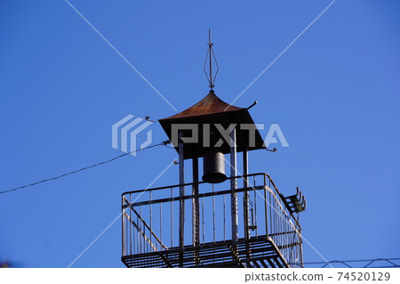 A half bell on the fire lookout tower that convenes a rural fire brigade A half bell on the fire lookout tower that convenes a rural fire brigade 74520129