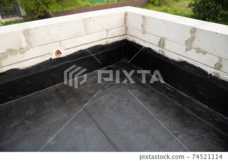the terrace is covered with a layer of waterproofing roofing material the terrace is covered with a layer of waterproofing roofing material 74521114