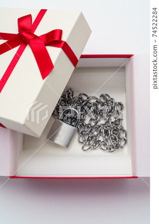 Padlock chained to a gift box 74522284