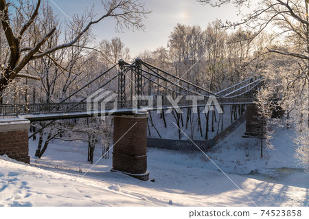 Russia. Winter view of the hanging Makarovsky Bridge over the ravine of the Petrovsky dock in Kronstadt. 74523858