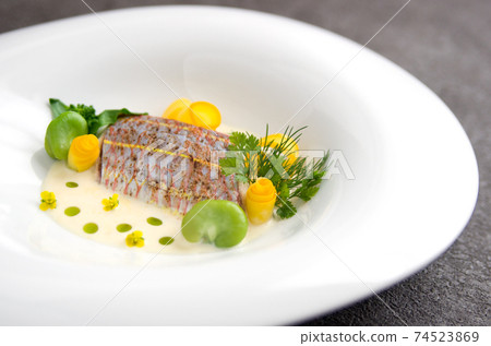 Poire of fish (Itoyori), spring vegetables and cream sauce Poire of fish (Itoyori), spring vegetables and cream sauce 74523869