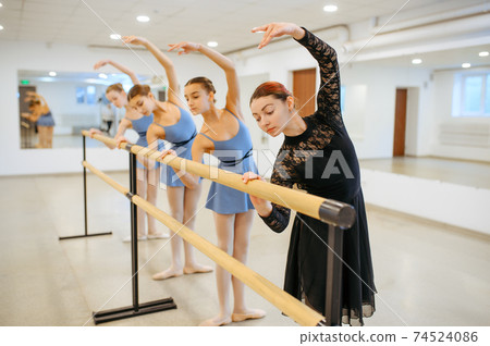 Master and young ballerinas rehearsing in class Master and young ballerinas rehearsing in class 74524086