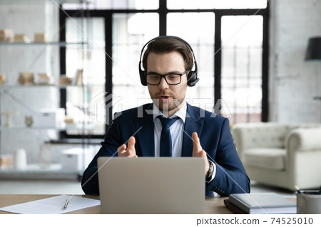 Caucasian businessman talk on video call with client 74525010