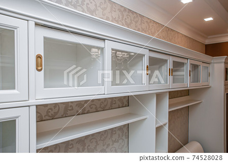 Classical style bookcase with glass doors and gilded handles 74528028