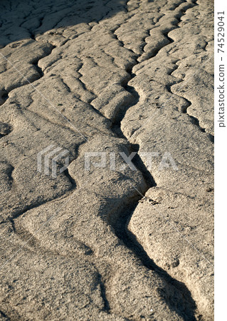 Cracked ground during hot drought climate. Cracked ground during hot drought climate. 74529041