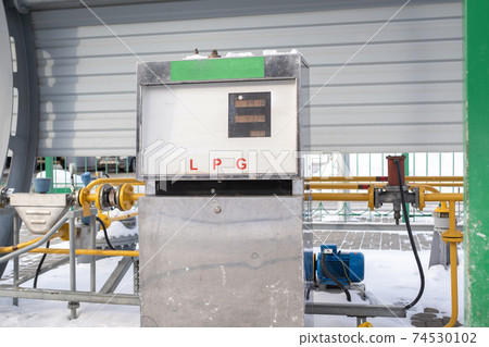 Complex for filling a car with gas at a gas station 74530102