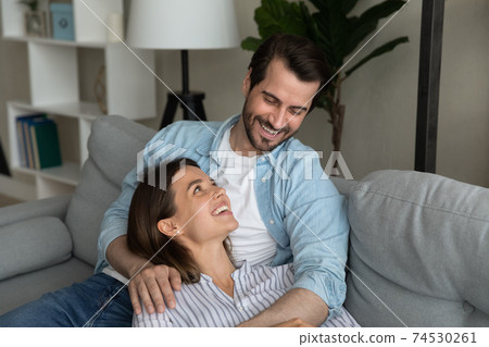 Young wife rest in husband arms tell about her day Young wife rest in husband arms tell about her day 74530261
