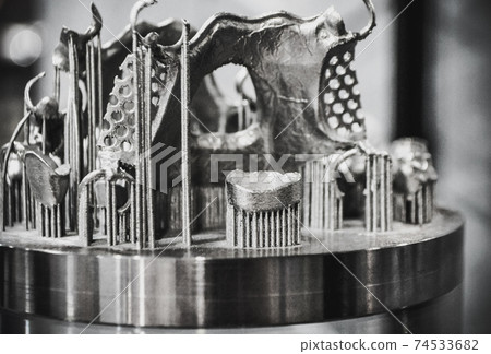 Object printed on metal 3d printer close-up Object printed on metal 3d printer close-up 74533682