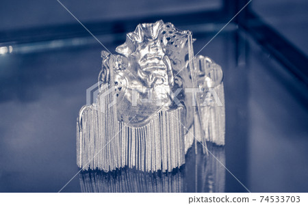 Object printed on metal 3d printer close-up 74533703