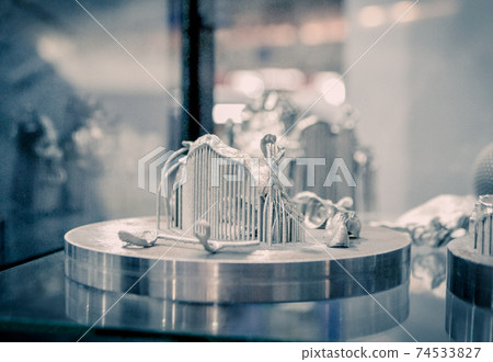 Object printed on metal 3d printer close-up. 74533827