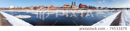 Poznan. Cathedral on Tumskiy Island on a winter day. Poznan. Cathedral on Tumskiy Island on a winter day. 74533879