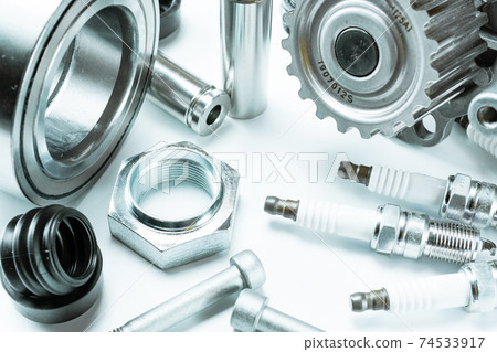 Car engine parts. Auto motor mechanic spare or automotive piece on white background. Set of new metal car part. Automobile engine service. Car engine parts. Auto motor mechanic spare or automotive piece on white background. Set of new metal car part. Automobile engine service. 74533917