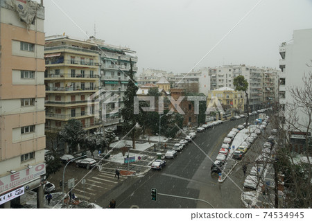 Thessaloniki, Greece Medea front hits with heavy snowfall the city center. 74534945