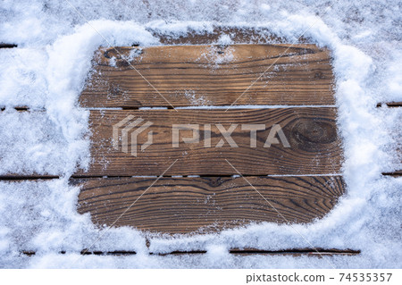 Winter background. Empty wooden plank with snow border, copy space for text 74535357