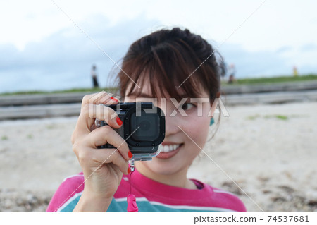 Woman shooting with an action camera - Stock Photo [74537681] - PIXTA