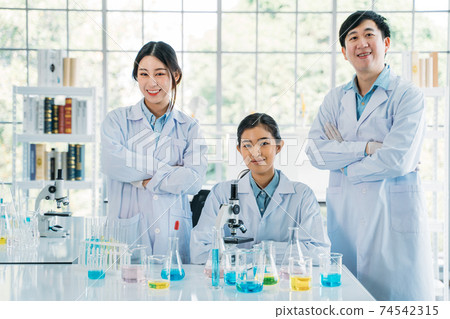 Young man and woman in research lab 74542315