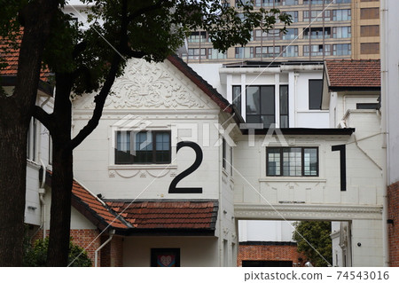 Fashionable wall building with numbers Fashionable wall building with numbers 74543016