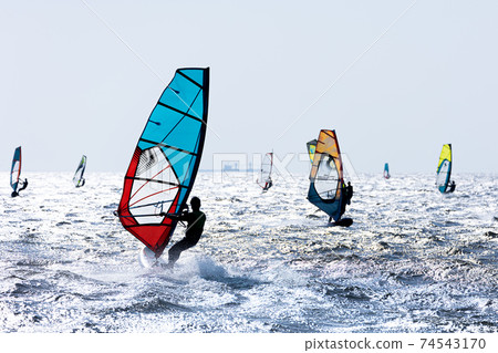 Windsurfing running in the wind 74543170