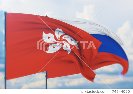Waving Russian flag and flag of Hong Kong. Closeup view, 3D illustration. 74544030