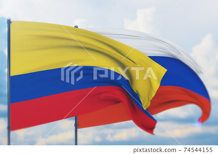 Waving Russian flag and flag of Colombia. Closeup view, 3D illustration. 74544155