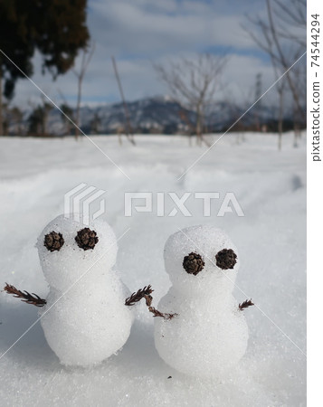 Snowman playing in the snow winter image Snowman playing in the snow winter image 74544294