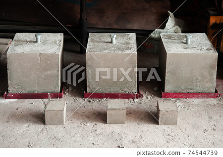 Steel bolt in concrete block for strength testing Steel bolt in concrete block for strength testing 74544739