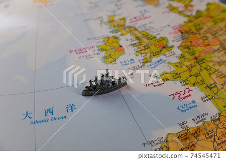 A ship traveling through the Atlantic Ocean on a map 74545471