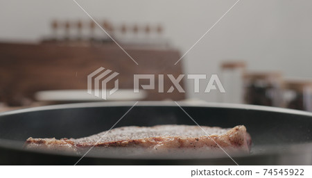 new york steak on nonstick pan new york steak on nonstick pan 74545922