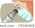 Woman medical specialist looks through a microscope 74546068