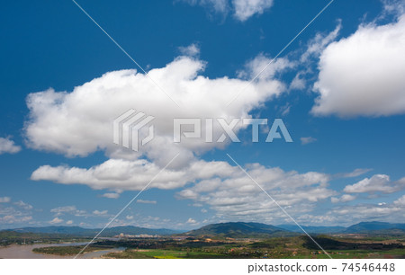 The sky has clouds and the Mekong River.sky and cloud.white clouds.Village near the river.Border river.River border Thailand and Laos. Chiang Saen,Chiang Rai. 74546448