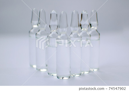 Medical ampoules for injection isolated on white background. Medicines and disease treatment, pharmacology and science concepts Medical ampoules for injection isolated on white background. Medicines and disease treatment, pharmacology and science concepts 74547902